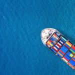 Aerial view of container cargo ship in sea.